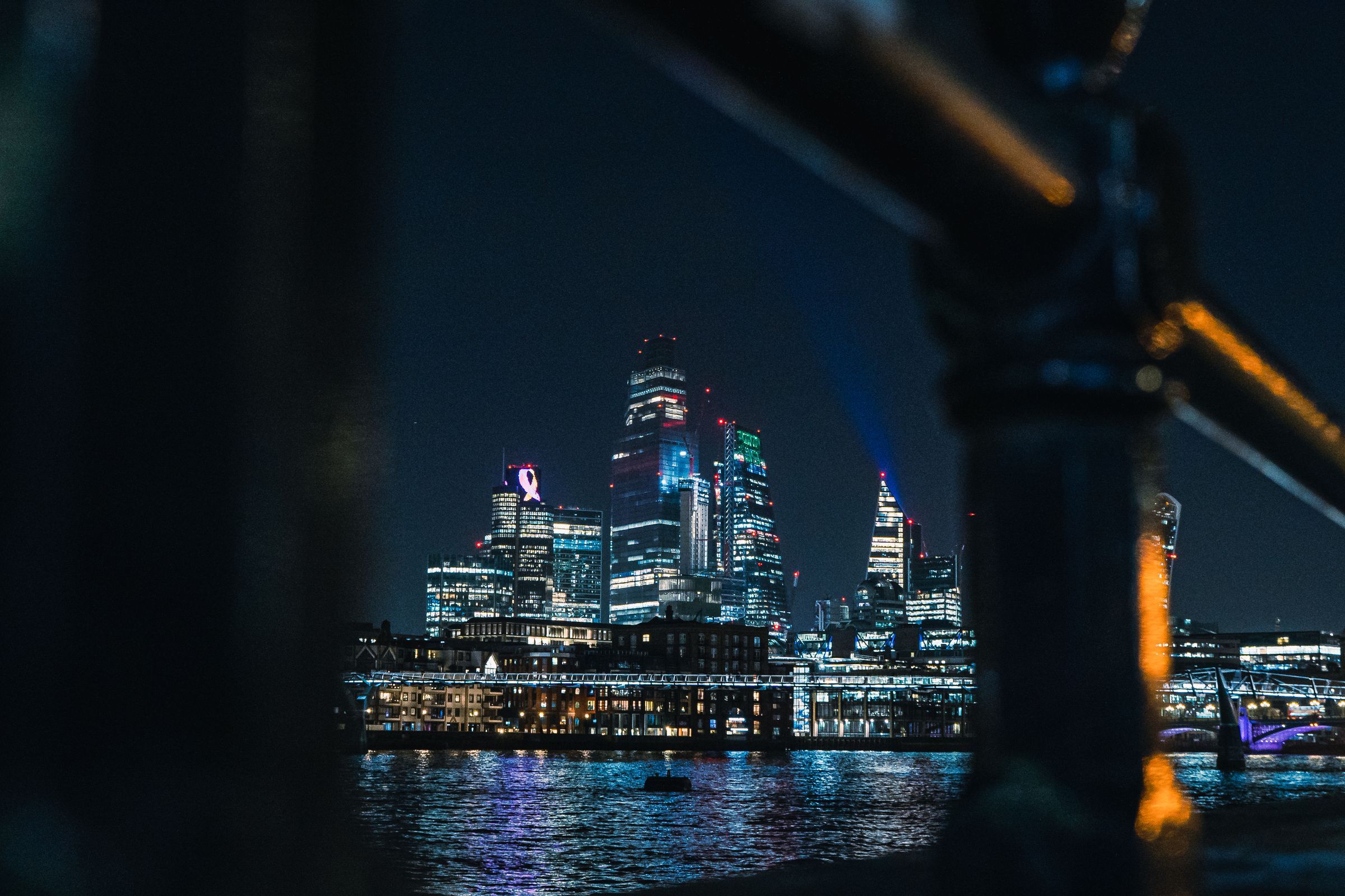 The City of London at night, seen from across the river